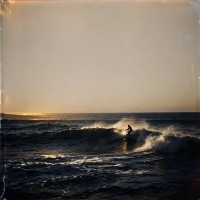 Square 1:1 album cover artwork: the last light on ocean waves, a lone surfer silhouette, expired film, pure shoegaze energy. Raw flash-photo look, in