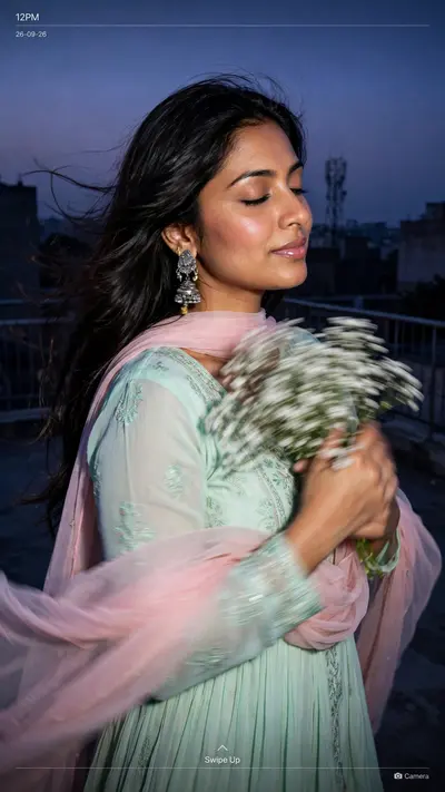 Create an ultra-realistic candid rooftop closeup portrait of the woman in the reference image as a lockscreen wallpaper, at blue hour, with a dusky