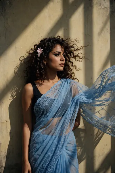 Create a retro vintage grainy but bright image of the reference picture but draped a perfect blue Pinteresty aesthetic reti? saree . it must feel