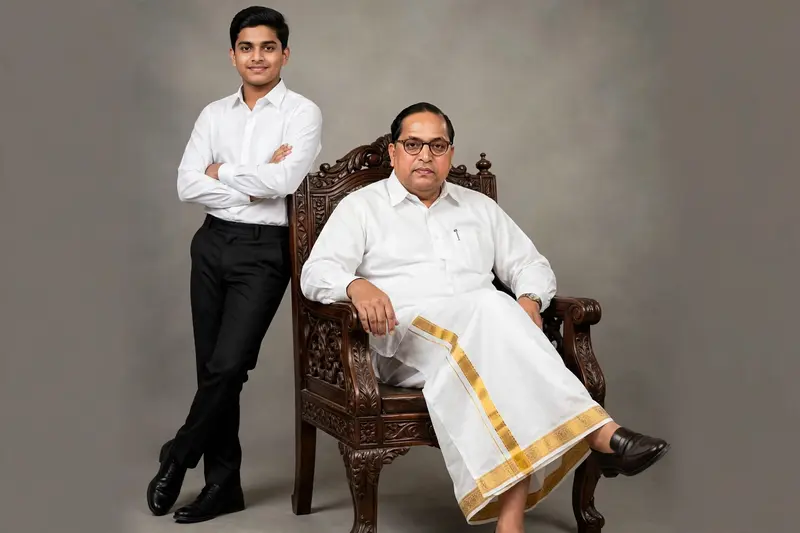 A professional full-body studio portrait of a father and son. On the right, the father is Dr bhim rav Ambedkar majestically in a dark wooden ornate